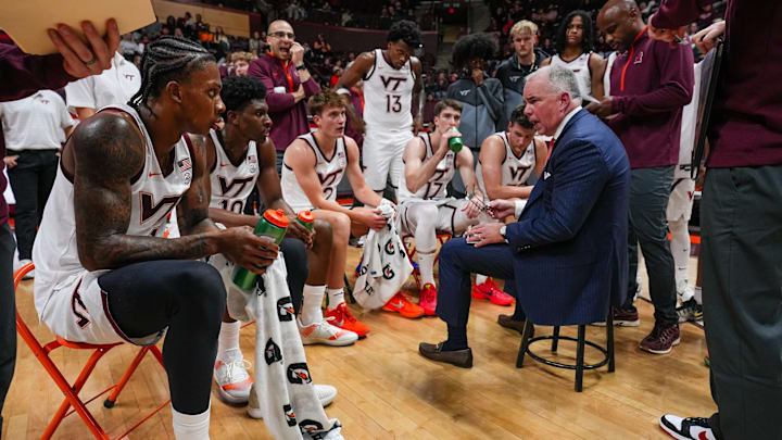 Mike Young addressing the team during a timeout. Credit - Virginia Tech Athletics