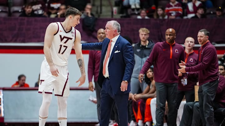 Mike Young talks to Neo Avdalas during Virginia Tech season opener. Credit - Virginia Tech Athletics