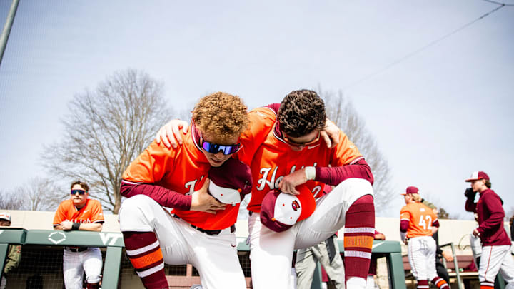 Two players pregame before Virginia Tech plays William & Mary.