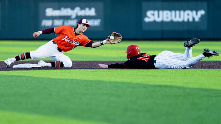 Ethan Ball attempting to tag out a would-be base stealer against Rutgers in 2026.