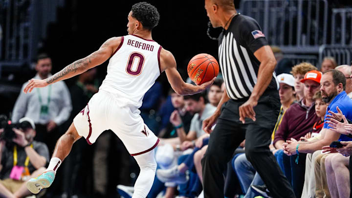 Jailen Bedford saving a ball from going out of bounds in the first round of the ACC Tournament against Wake Forest.