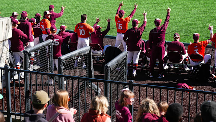 Virginia Tech dugout celebrating a big hit vs Duke in 2026.