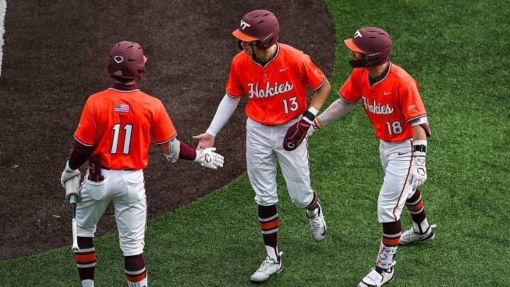 BLACKSBURG, Va. — Ethan Ball, Treyson Hughes and Hudson Lutterman celebrate a three-run home run. BLACKSBURG, Va. — Ethan Ball, Treyson Hughes and Hudson Lutterman celebrate a three-run home run.