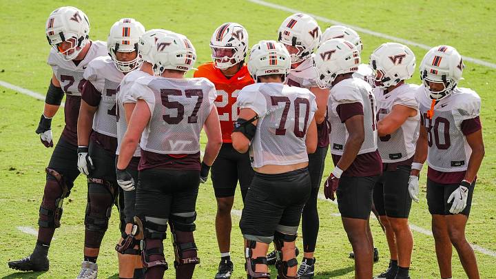 BLACKSBURG, Va. — Bryce Baker in the huddle with the Virginia Tech offense in fall camp.