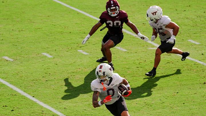 BLACKSBURG, Va. — Ayden Greene runs after the catch in a fall-camp scrimmage set. BLACKSBURG, Va. — Ayden Greene runs after the catch in a fall-camp scrimmage set.