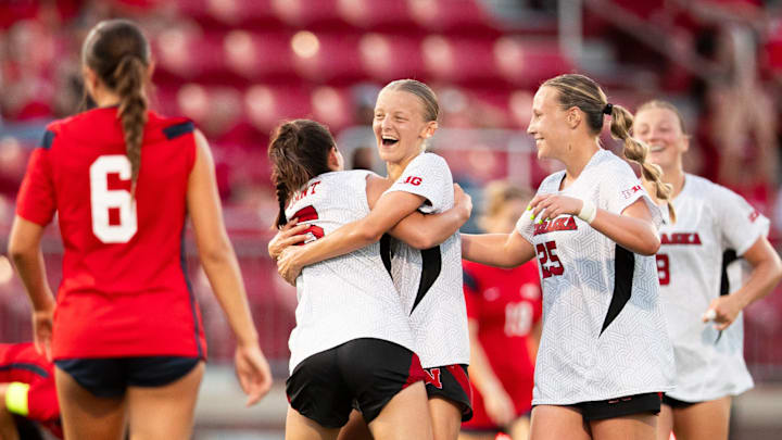 Nebraska soccer players celebrate during their 6-0 win Thursday over Southern Indiana.