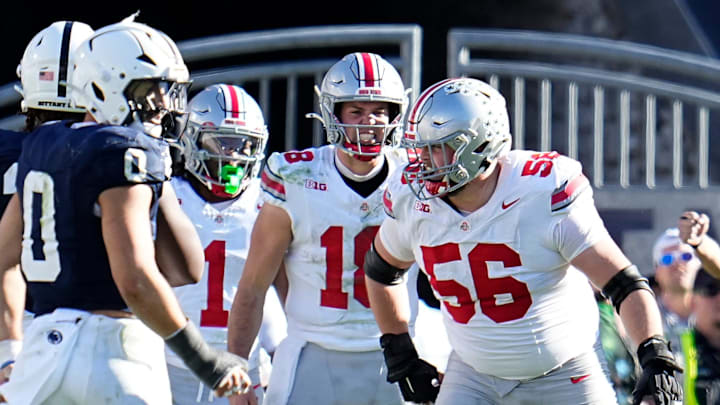 Ohio State Buckeyes quarterback Will Howard (18)tries to call a play behind offensive lineman Seth McLaughlin (56) during the NCAA football game against the Penn State Nittany Lions at Beaver Stadium in University Park, Pa. on Monday, Nov. 4, 2024. Ohio State won 20-13.