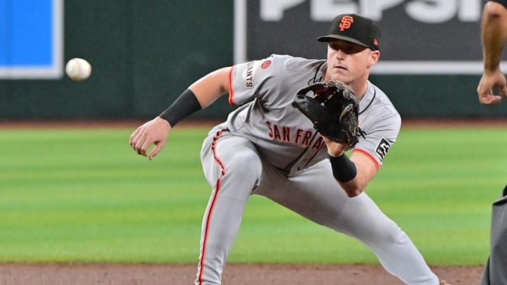 Sep 25, 2024; Phoenix, Arizona, USA; San Francisco Giants shortstop Tyler Fitzgerald (49) catches the ball to stop Arizona Diamondbacks outfielder Corbin Carroll (7) from stealing second base in the first inning at Chase Field. Mandatory Credit: Matt Kartozian-Imagn Images