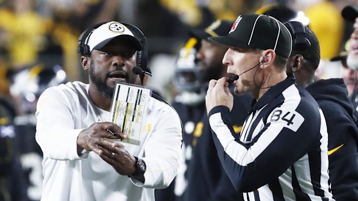 Oct 20, 2024; Pittsburgh, Pennsylvania, USA;  Pittsburgh Steelers head coach Mike Tomlin (left) asks line judge Jay Bilbo (84) for a time-out against the New York Jets during the fourth quarter at Acrisure Stadium. Mandatory Credit: Charles LeClaire-Imagn Images