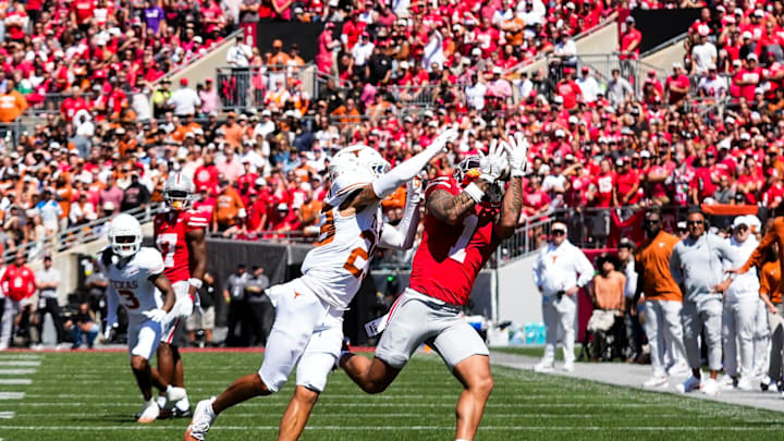 Ohio State Buckeyes wide receiver Brandon Inniss (1) attempts to catch a pass against Texas Longhorns defensive back Jordon Johnson-Rubell (23) in the first half at Ohio Stadium on Saturday, Aug. 30, 2025 in Columbus, Ohio.