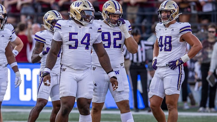 Anterio Thompson, Bryce Butler and Jacob Lane wait for the next play for the Huskies. Anterio Thompson, Bryce Butler and Jacob Lane wait for the next play for the Huskies.