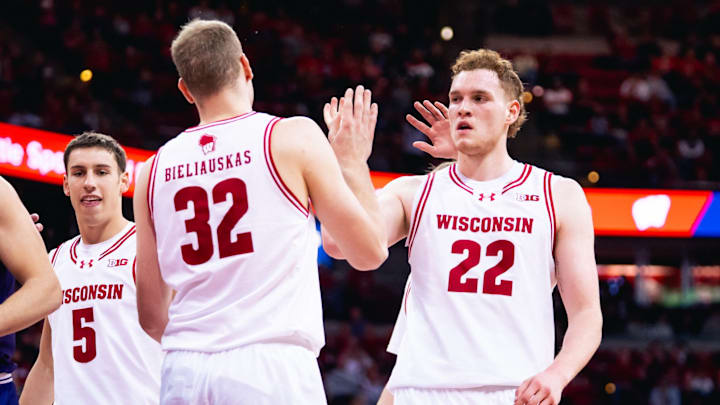 Austin Rapp (22) celebrated Aleksas Bieliauskas (32) basket and getting fouled in the first half. Wisconsin beat Northwestern, 85-73, to open Big Ten play on December 3, 2025.