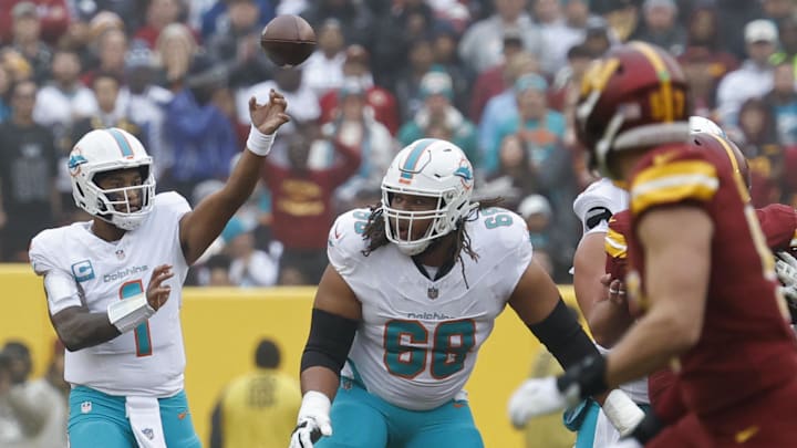 Dec 3, 2023; Landover, Maryland, USA; Miami Dolphins quarterback Tua Tagovailoa (1) passes the ball