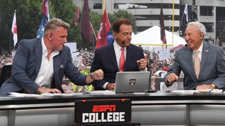 Pat McAfee Nick Saban, and Lee Corso fist bump before live broadcast during ESPN Gameday near Williams-Brice Stadium in Columbia, S.C., Saturday, September 14, 2024.
