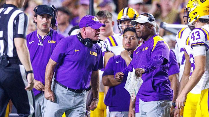 New LSU interim coach Frank Wilson (at right, here with Brian Kelly) has historical ties to former LSU coach Ed Orgeron... and another prominent SEC coach.