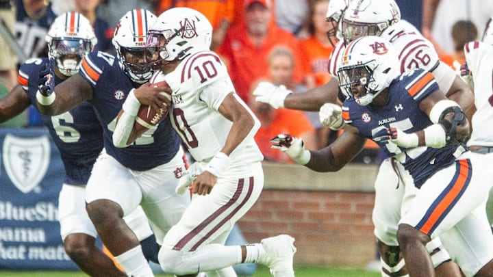 Auburn Tigers defensive lineman Malik Blocton (47) chases Alabama A&M Bulldogs quarterback Cornelious Brown IV (10) in the backfield as Auburn Tigers takes on Alabama A&M Bulldogs at Jordan-Hare Stadium in Auburn, Ala., on Saturday, Aug. 31, 2024. Auburn Tigers lead Alabama A&M Bulldogs 52-3 at halftime.