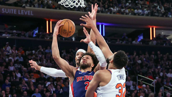 Detroit Pistons guard Cade Cunningham looks to drive past New York Knicks guard Josh Hart. Mandatory Credit: Wendell Cruz-Imagn Images