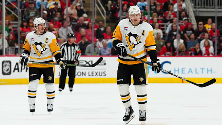 Nov 7, 2024; Raleigh, North Carolina, USA;  Pittsburgh Penguins center Sidney Crosby (87) and center Evgeni Malkin (71) skate up the ice against the Carolina Hurricanes during the second period at Lenovo Center. Mandatory Credit: James Guillory-Imagn Images