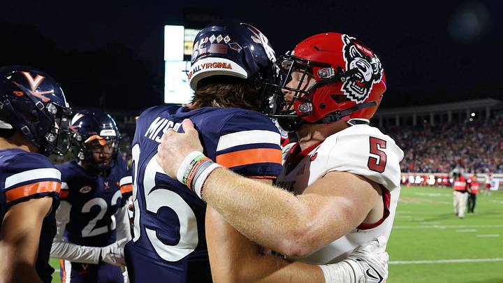 Grant Misch and Brennan Armstrong embrace in the latter's return to Scott Stadium, Sept. 22, 2023. Grant Misch and Brennan Armstrong embrace in the latter's return to Scott Stadium, Sept. 22, 2023.