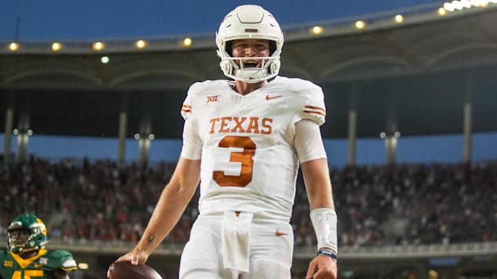 Texas quarterback Quinn Ewers (3) celebrates a touchdown against Baylor in the third quarter of an