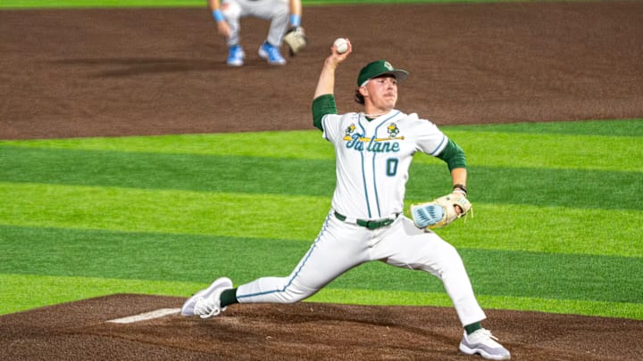 Tulane pitcher delivers a pitch to the opposing side.