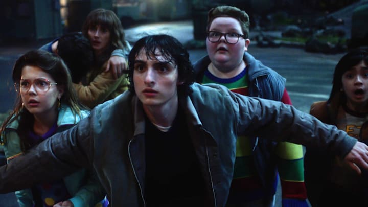 Winona Ryder as Joyce Byers, Finn Wolfhard as Mike Wheeler and Jake Connelly as Derek in Stranger Things season 5.