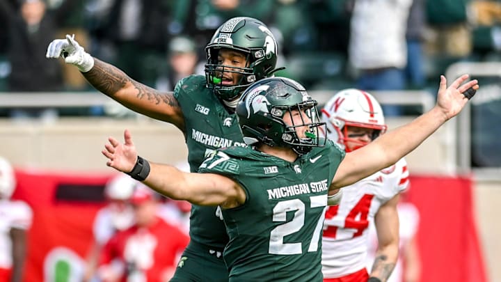 Michigan State's Jordan Hall, left, and Cal Haladay celebrate after beating Nebraska on Saturday,