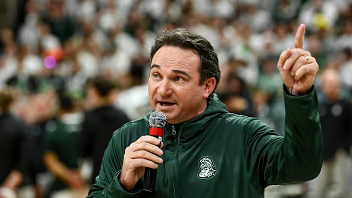 Michigan State's new football coach Jonathan Smith speaks to the crowd during a timeout in the