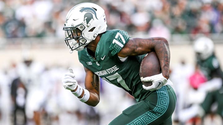 Michigan State's Tre Mosley runs after a pass against Washington during the second quarter on