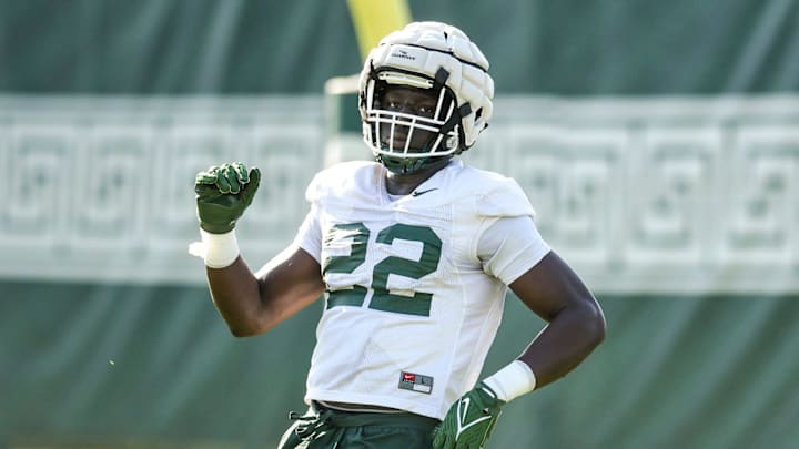 Michigan State defensive lineman Jordon Bai Jobe runs a drill during the opening day of MSU's