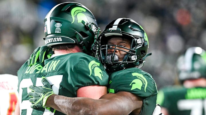 Michigan State's Kenneth Walker III, right, hugs J.D. Duplain after Walker's touchdown run against Maryland during the fourth quarter on Saturday, Nov. 13, 2021, at Spartan Stadium in East Lansing.

211113 Msu Maryland 156a