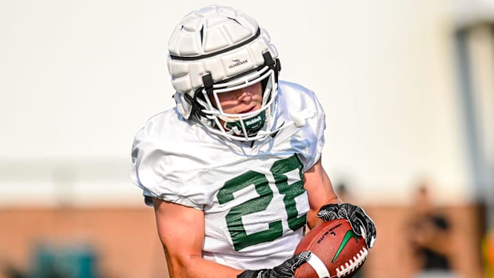 Michigan State's Tate Hallock catches a pass during the opening day of fall camp on Thursday, Aug. 5, 2021, on the MSU campus in East Lansing.

210805 Msu Fball Camp 060a