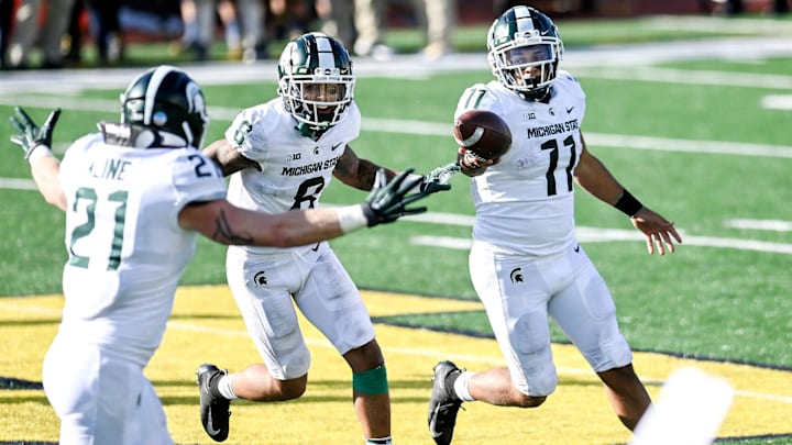 Michigan State's Connor Heyward, right, celebrates with teammates Jalen Nailor, center, and Chase Kline after Heyward recovered the Michigan onside kick late during the fourth quarter on Saturday, Oct. 31, 2020, at Michigan Stadium in Ann Arbor.

201031 Msu Um 188a