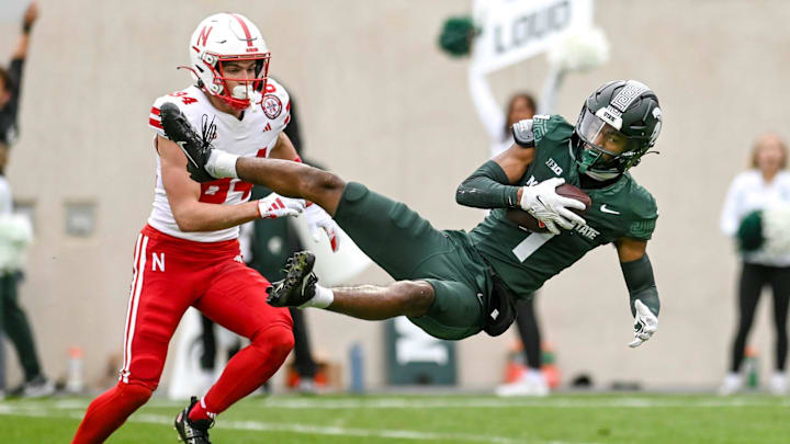 Michigan State's Jaden Mangham intercepts a Nebraska pass during the first quarter on Saturday, Nov.