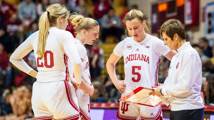 Indiana Head Coach Teri Moren instructs Julianna LaMendola (20), Lexus Bargesser (1).