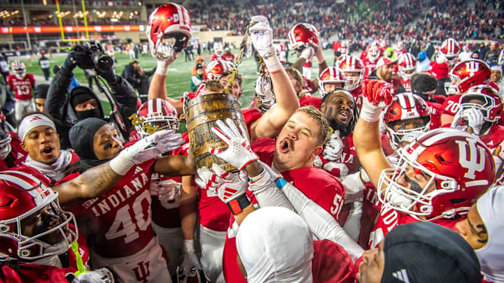 Indiana's Mike Katic (56) and the Hoosiers hoist the Old Oaken Bucket after the Indiana versus Purdue football game at Memorial Stadium on Saturday, Nov. 30, 2024.