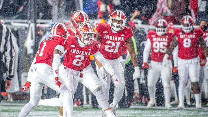 Indiana's Jalin Walker (2) and the Hoosier celebrate his interception during the Indiana versus Purdue football game at Memorial Stadium on Saturday, Nov. 30, 2024.
