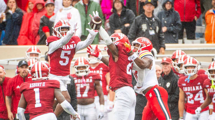 Indiana's D'Angelo Ponds (5) and Jamari Sharpe (22) break up a pass during the Indiana versus Maryland football game at Memorial Stadium on Saturday, Sept. 28, 2024.