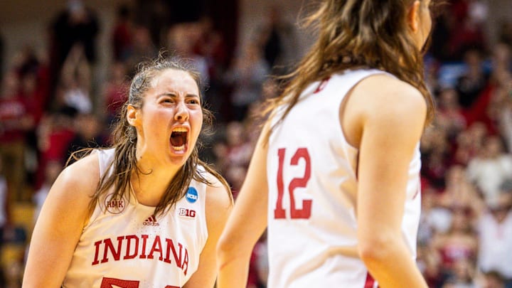 Indiana's Mackenzie Holmes (54) celebrates with Yarden Garzon (12) during the fourth quarter during second round NCAA action at Simon Skjodt Assembly Hall on Saturday, March 23, 2204.