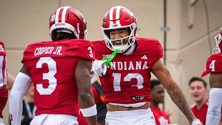 Indiana's Elijah Sarratt (13) and Omar Cooper Jr. (3) celebrates Sarratt's touchdown during the Indiana versus Michigan football game at Memorial Stadium on Friday, Nov. 9, 2024.
