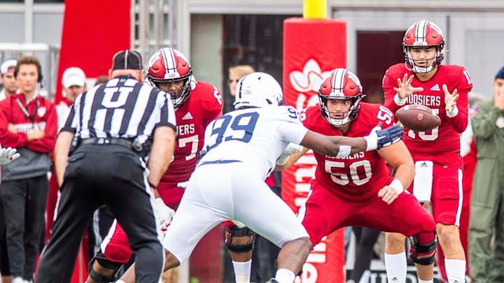 Indiana's Brendan Sorsby (15) takes the snap from Zach Carpenter (50) during the first half of the