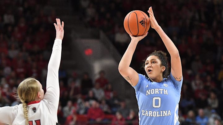 North Carolina's Alexandra Zelaya (0) takes the jump shot over N.C State's Maddie Cox (11) during