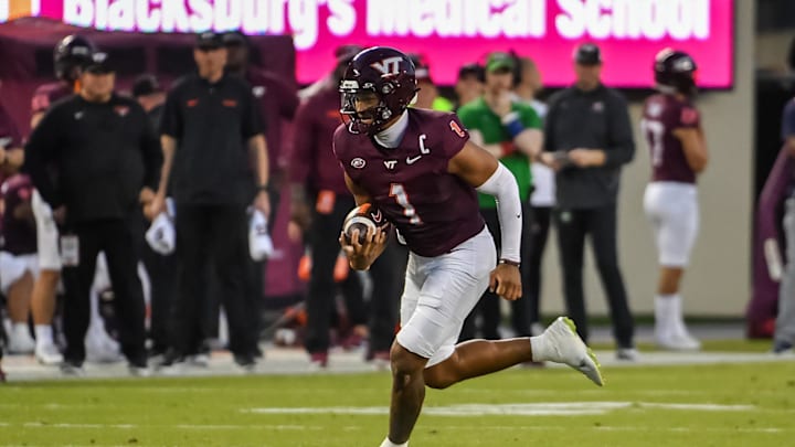 Sep 13, 2025; Blacksburg, Virginia, USA;  Virginia Tech Hokies cornerback Dante Lovett (1) runs the ball during the first quarter at Lane Stadium. Mandatory Credit: Brian Bishop-Imagn Images