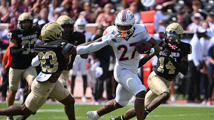 Sep 20, 2025; Blacksburg, Virginia, USA; Virginia Tech Hokies running back Marcellous Hawkins (27) runs the ball as Wofford Terriers cornerback Cole Walker (23) defends during the first quarter at Lane Stadium. Mandatory Credit: Brian Bishop-Imagn Images Sep 20, 2025; Blacksburg, Virginia, USA; Virginia Tech Hokies running back Marcellous Hawkins (27) runs the ball as Wofford Terriers cornerback Cole Walker (23) defends during the first quarter at Lane Stadium. Mandatory Credit: Brian Bishop-Imagn Images