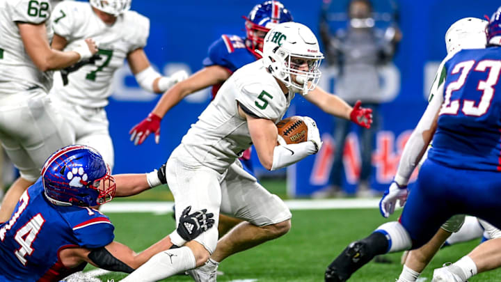 Forest Hills Central's Ty Hudkins runs for a gain against Mason during the first quarter on Sunday, Nov. 26, 2023, at Ford Field in Detroit.