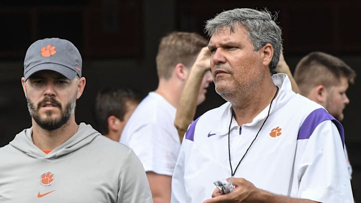 Clemson offensive coordinator Garrett Riley, left, and offensive line coach Matt Luke look at offensive linemen during the 2024 Dabo Swinney Football Camp in Clemson in Clemson, S.C. Tuesday, June 4, 2024.