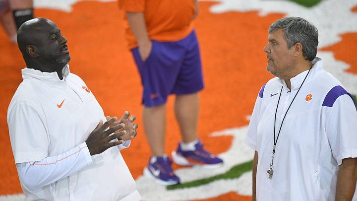 Clemson defensive ends coach Chris Rumph and offensive line coach Matt Luke talk during August practice in Clemson, S.C. Friday August 2, 2024.