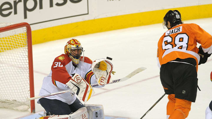March 20, 2012; Philadelphia, PA USA; Florida Panthers goalie Scott Clemmensen (30) makes a save against Philadelphia Flyers right wing Jaromir Jagr (68) during the 3rd period of game at the Wells Fargo Center in Philadelphia. The Panthers defeated the Flyers, 2-1.