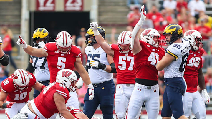 University of Wisconsin Badgers football players celebrate a 4th down stop against Michigan during their game Saturday, October 2, 2021 in Madison, Wis. Michigan won the game 38-17. 