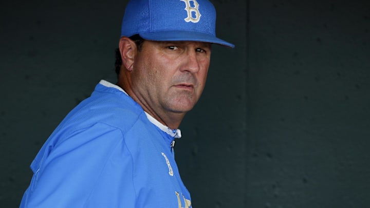 Jun 21, 2013; Omaha, NE, USA; UCLA Bruins head coach John Savage (22) looks out from the dugout prior to the game against the North Carolina Tarheels during the College World Series at TD Ameritrade Park. Mandatory Credit: Bruce Thorson-Imagn Images